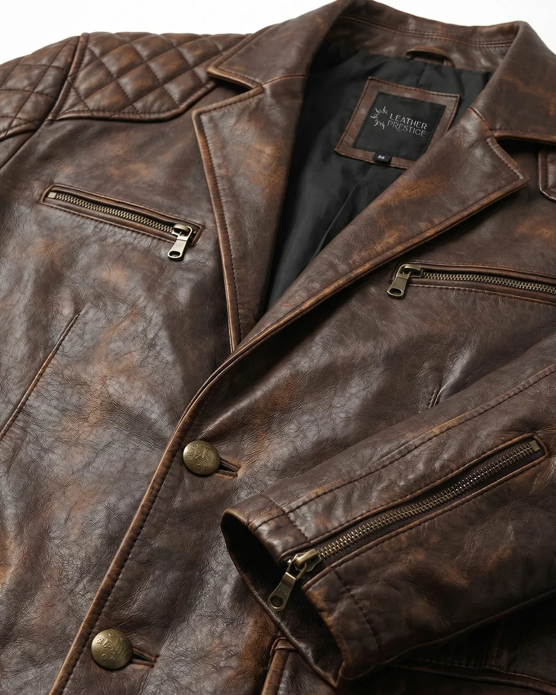 Close-up of a brown leather jacket with visible branding