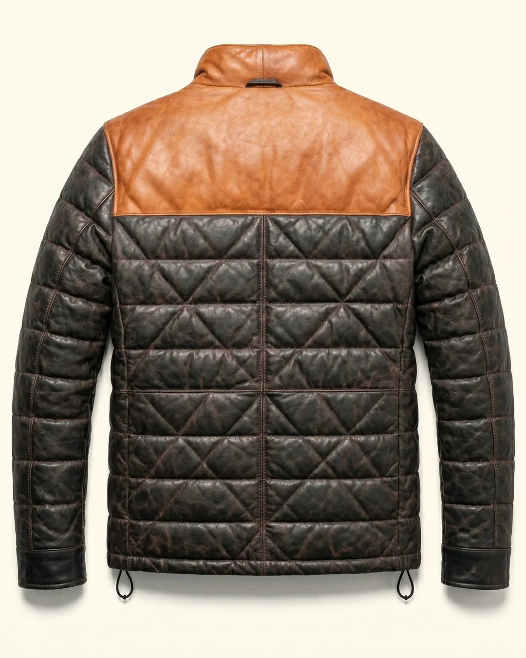 Quilted jacket with brown leather panels on a white background