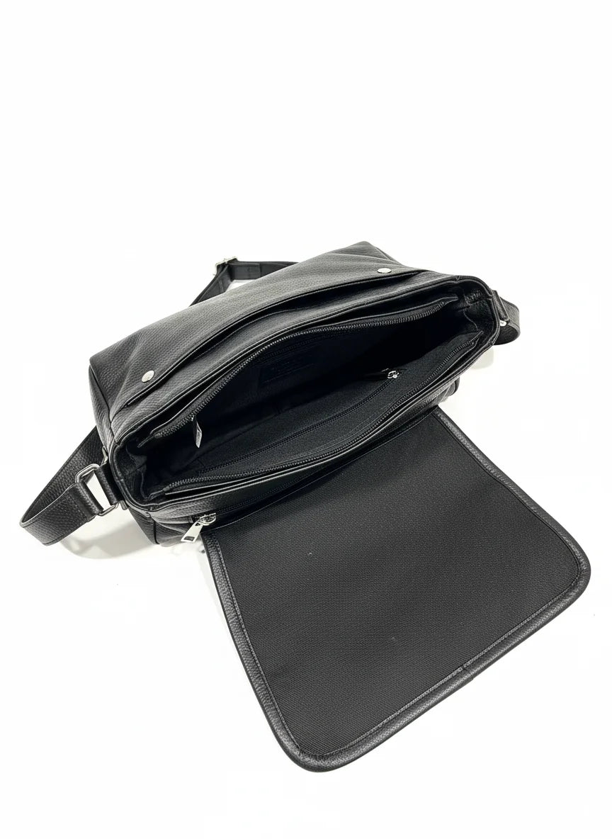 Black leather crossbody bag on a white background