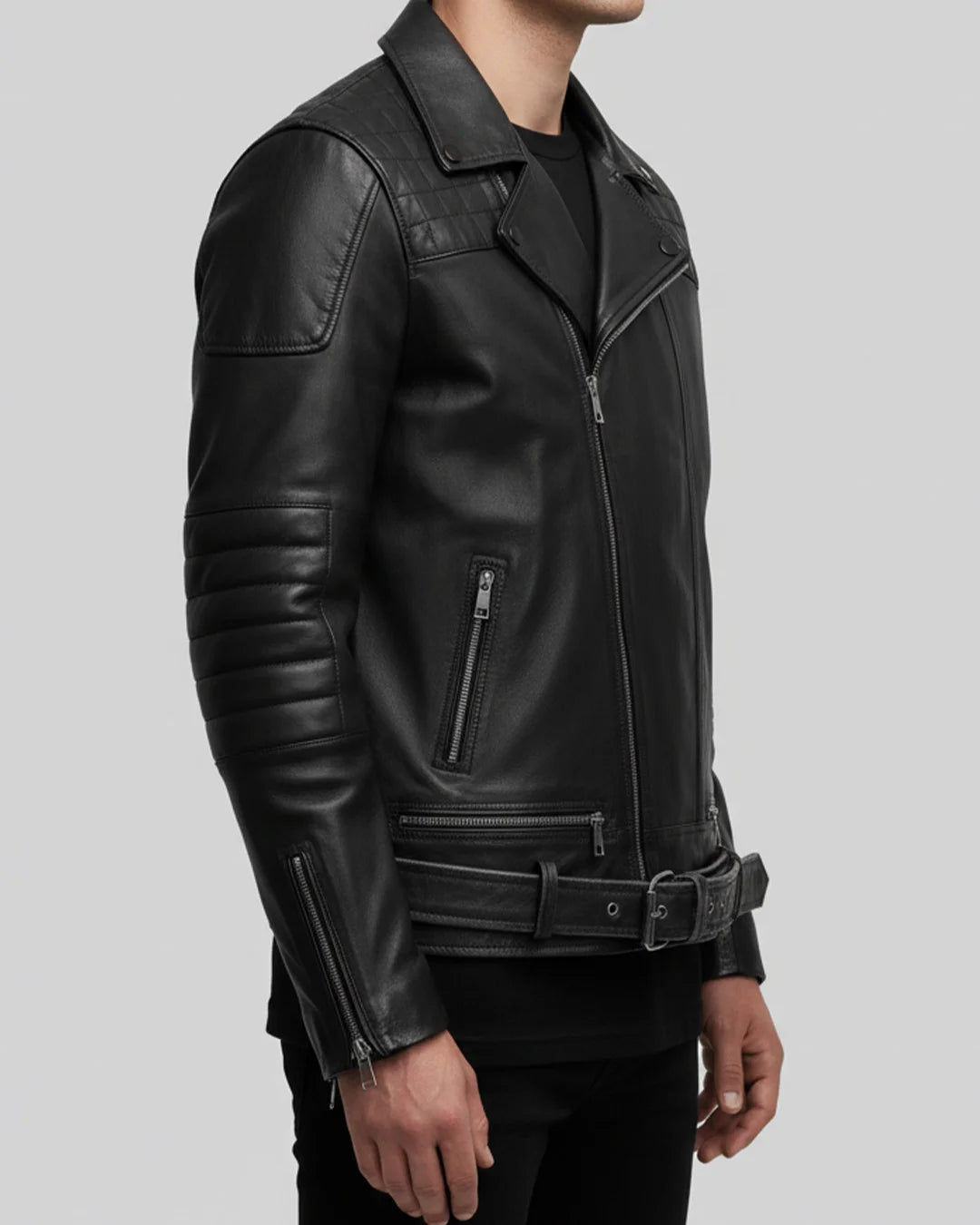 Black leather jacket worn by a person on a light gray background