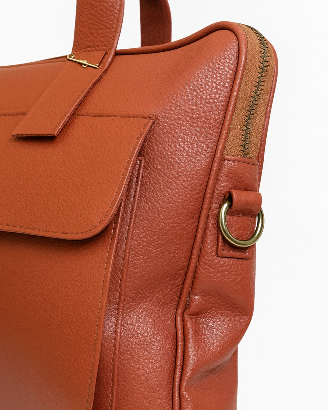 Brown leather backpack with gold accents on a white background