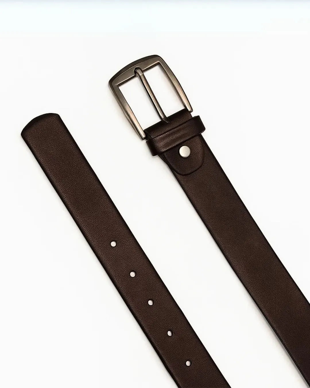 Brown leather belt with a silver buckle on a white background