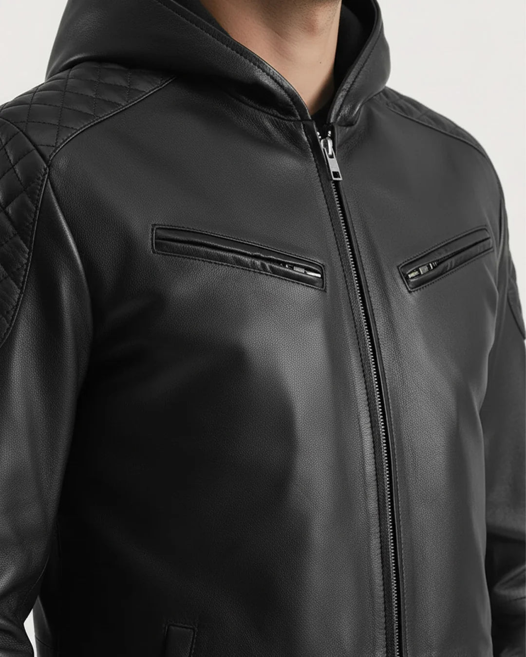 Black leather jacket with quilted shoulder design on a white background